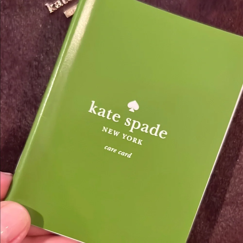 NWT kate spade burgundy suede pouch with gold logo